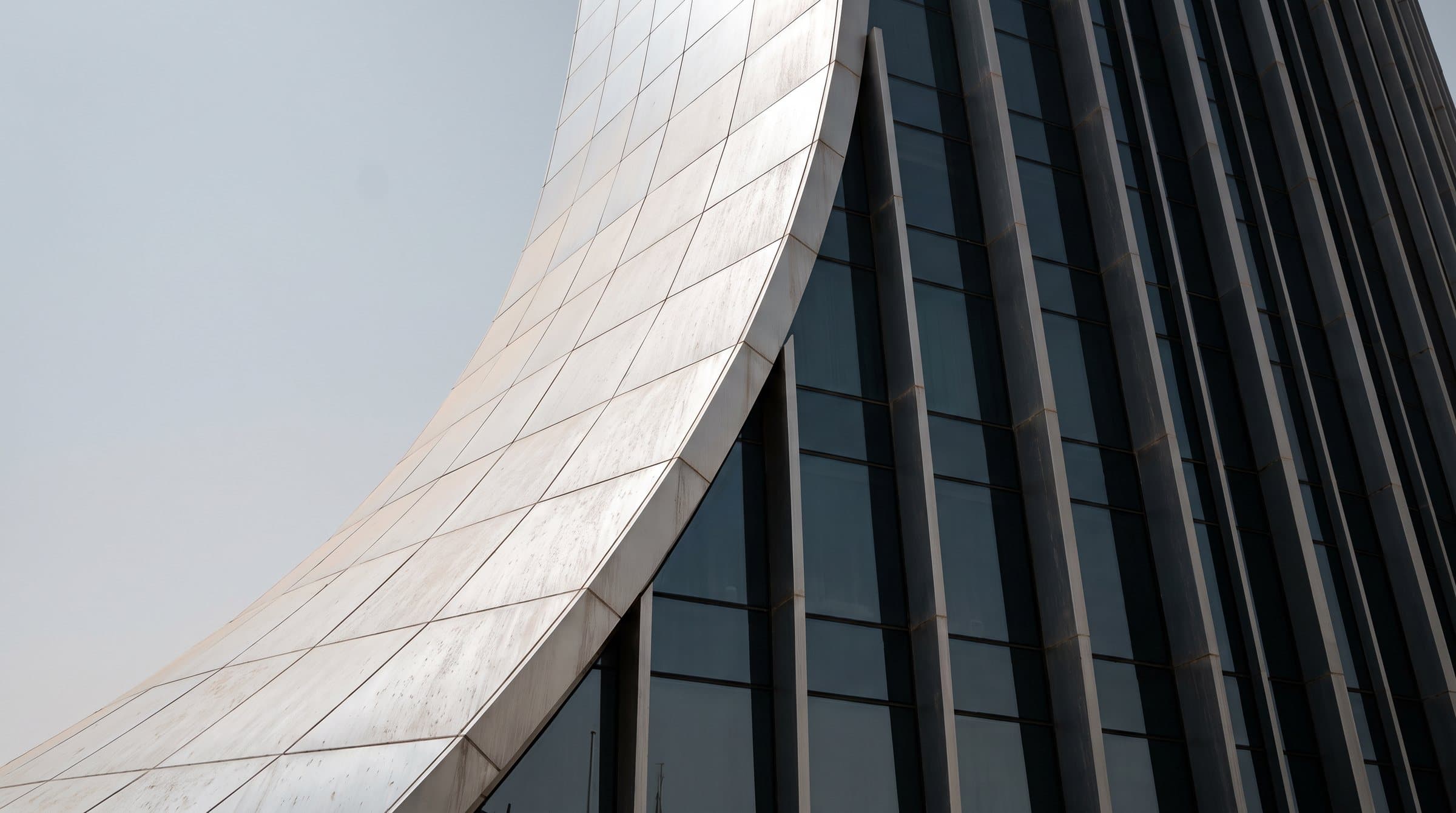 Curved white façade and glass